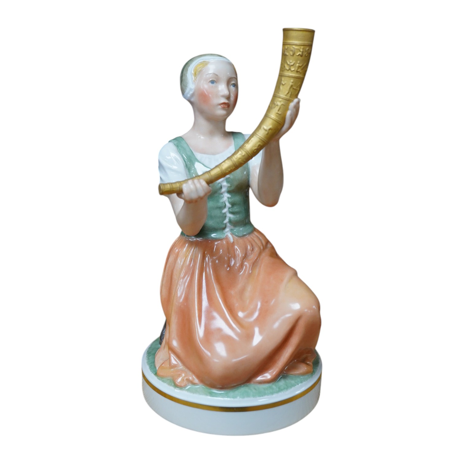 A Royal Copenhagen figure of Kristine Svendsdatter, carrying the gilded horn of Gallahus, numbered 12242, 21cm high. Condition - good